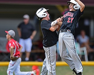 Game 1BOARDMAN, OHIO - JULY 31, 2016: Connor Miller #10 of Canfield celebrates with Broc Lowry #27 after he scored the game winning run on a hit by Lowry in the seventh inning of Game 1 of Sunday afternoon Little League Championship DoubleHeader. Canfield won 7-6 in 7 innings. DAVID DERMER | THE VINDICATOR