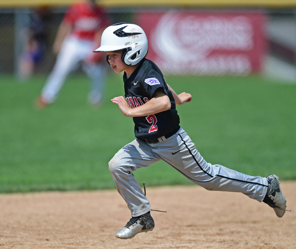 Game 2BOARDMAN, OHIO - JULY 31, 2016: Base runner Ty Stricko #2 of Canfield advances to third base on a wild pitch in the second inning of Game 2 of Sunday afternoon Little League Championship DoubleHeader. Canfield won 7-6 in 7 innings. DAVID DERMER | THE VINDICATOR