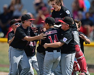 Game 2BOARDMAN, OHIO - JULY 31, 2016: Starting pitcher Ben Slanker #14 of Canfield is mobbed by his teammates including Broc Lowry #27, AJ Havrillay #3, Connor Daggett #5, Jake Schneider #12 after the final strike out of the fourth inning of Game 2 of Sunday afternoon Little League Championship DoubleHeader. Canfield won 7-6 in 7 innings. DAVID DERMER | THE VINDICATOR