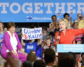 Jeff Lange | The Vindicator  SAT, JUL 31, 2016 - Democratic presidential nominee Hillary Clinton speaks as (from left) former President Bill Clinton, Anne Holton and US Senator from Virginia Tim Kaine look on during Hillary's campaign rally at East High School, late Saturday evening.