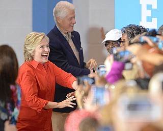 Jeff Lange | The Vindicator  SAT, JUL 30, 2016 - Democratic presidential nominee Hillary Clinton shakes hands with supporters as she enters the East High School gymnasium during her rally in Youngstown Saturday night.