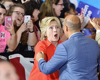 Jeff Lange | The Vindicator  SAT, JUL 31, 2016 - Supporters take photos as Democratic presidential nominee Hillary Clinton (facing) greets State Senator Joe Shiavoni upon her arrival to the East High School gymnasium for her campaign rally, late Saturday evening.