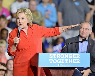 Jeff Lange | The Vindicator  SAT, JUL 31, 2016 - Democratic presidential nominee Hillary Clinton (left) speaks as US Senator from Virginia Tim Kaine looks on from behind during a campaign rally at East High School.