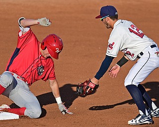 NILES, OHIO - AUGUST 1, 2016: Base runner David Martinelli #31 of the Crosscutters slides into second to complete a RBI double as short stop Alexis Pantoja #12 mis played the baseball in the first inning of Monday nights game at Eastwood Field. DAVID DERMER | THE VINDICATOR