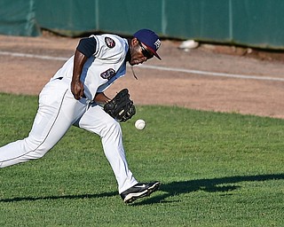 NILES, OHIO - AUGUST 1, 2016: Right fielder Silento Sayles #9 of the Scrappers drops the baseball allowing Darick Hall #46 of the Crosscutters to reach base in the first inning of Monday nights game at Eastwood Field. DAVID DERMER | THE VINDICATOR