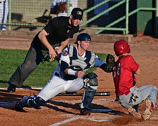 NILES, OHIO - AUGUST 1, 2016: Catcher Logan Ice #11 of the Scrappers tags out Evan Rogers #38 of the Crosscutters as he attempted to score from third base in the second inning of Monday nights game at Eastwood Field. DAVID DERMER | THE VINDICATOR