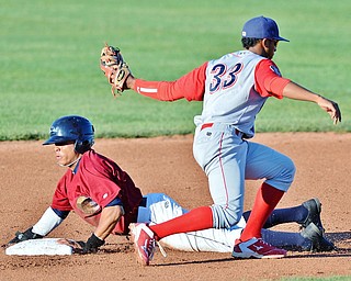 Jeff Lange | The Vindicator  TUE, AUG 2, 2016 - Scrappers' Todd Isaacs (bottom) fails to beat the tag as he attempts to steal second under Williamsport's Luis Espiritu in the first inning of Tuesday's game at Eastwood Field.