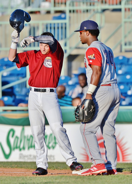 Jeff Lange | The Vindicator  TUE, AUG 2, 2016 - Scrappers' Mitch Longo (left) wipes his brow after hitting a single in the bottom of the second inning as Williamsport's Luis Encarnacion looks on during Tuesday's game at Eastwood Field.