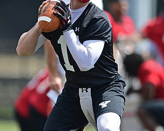 YOUNGSTOWN, OHIO - AUGUST 5, 2016: Quarterback Trent Hosick #11 of YSU drops back to pass during a 11 on 11 session of practice Friday afternoon at Stambaugh Stadium. DAVID DERMER | THE VINDICATOR