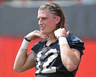 YOUNGSTOWN, OHIO - AUGUST 5, 2016: Quarterback Ricky Davis #12 of YSU fixes his hair on the sideline in-between reps during a 11 on 11 session of practice Friday afternoon at Stambaugh Stadium. DAVID DERMER | THE VINDICATOR
