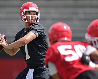 YOUNGSTOWN, OHIO - AUGUST 5, 2016: Nathan Mays looks downfield to pass the football during a 11 on 11 session of practice Friday afternoon at Stambaugh Stadium. DAVID DERMER | THE VINDICATOR