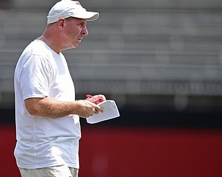 YOUNGSTOWN, OHIO - AUGUST 5, 2016: Head coach Bo Pelini watches from behind the formation during a 11 on 11 session of practice Friday afternoon at Stambaugh Stadium. DAVID DERMER | THE VINDICATOR