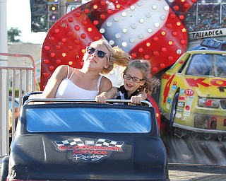 Nikos Frazier | The Vindicator..Chloe Rezord, 13, and her sister Ainsley Wagner, 6, at the St. Patrick Parish Festival in Hubbard.