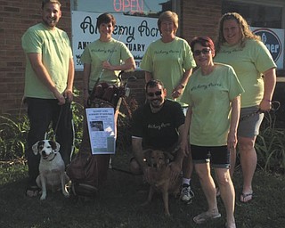 SPECIAL TO THE VINDICATOR
Alchemy Acres Animal Sanctuary will host its annual Gavin Ward Memorial Golf Tournament on Aug. 20 at Olde Dutch Mill Golf Course, 2745 Grandview Road, Lake Milton. Registration for the four person scramble will be $65 per person and includes a golf cart, beverages, breakfast, lunch and dinner. Teams that register and pay by Saturday will receive a dozen golf balls. Prizes will be given on each hole, with a two-year lease for a Chevy Cruze as the grand prize for a hole-in-one on the eighth hole. The Cruze is donated by Sweeney Chevrolet, who also will donate $5,000 to Alchemy Acres, if there is a winner. First place team will win $300; second place, $200; and third place, $100. The tournament is named for Gavin Ward, a volunteer of Alchemy Acres who died at age 12. Volunteers preparing for the event, in front from left, are Sal Salvino with Chanel, and Marina Berger; and in back are Andrew Grueber with Buckeye, Tricia Rogers, Trudy Nolder and Marie Hernandez. Proceeds from the event will benefit the sanctuary in Salem. For information call the sanctuary at 330-332-4897.