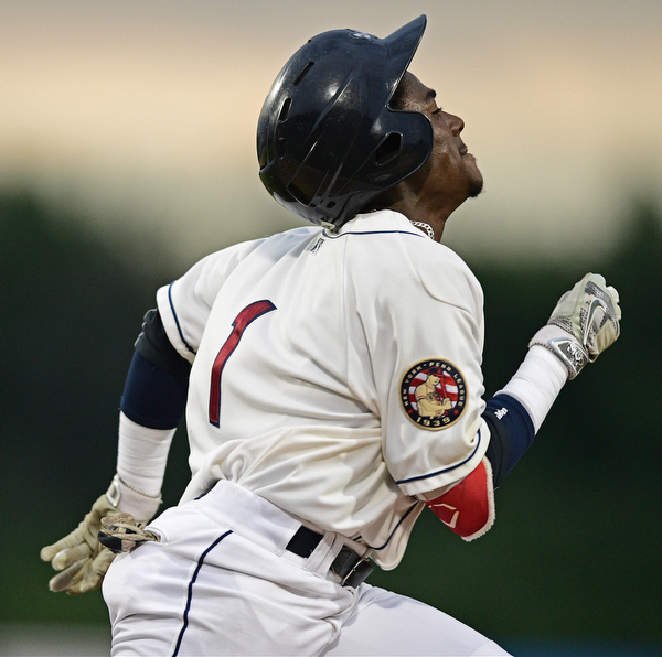 NILES, OHIO - AUGUST 10, 2016: Base runner Gabriel Mejia #1 of the Scrappers hustles to first to reach on a bunt in the first inning of Wednesday nights game at Eastwood Field. DAVID DERMER | THE VINDICATOR