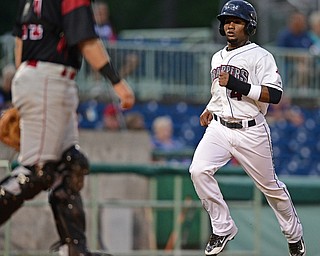 NILES, OHIO - AUGUST 10, 2016: Base runner Erlin Cerda #4 of the Scrappers comes home to score after a single by Gavin Collins in the first inning of Wednesday nights game at Eastwood Field. DAVID DERMER | THE VINDICATOR