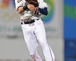 NILES, OHIO - AUGUST 10, 2016: Short stop Alexis Pantoja #12 of the Scrappers flies through the air to throw to first for the out in the second inning of Wednesday nights game at Eastwood Field. DAVID DERMER | THE VINDICATOR