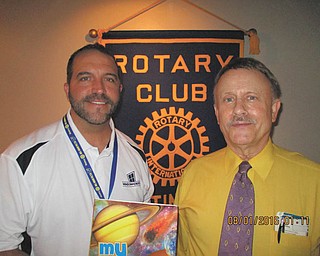 SPECIAL TO THE VINDICATOR | Rotary Club of Austintown featured John W. Street of Vienna as guest speaker at their Aug. 1 meeting. Street is a retired pilot involved with Rotaplast, a medical volunteer agency that works with cleft palate and cleft lip children in less fortunate coun- tries. He has taken four journeys to Mexico, Venezuela and Guatemala as a non-medical volunteer. Lack of funds has forced the cancellation of several recent missions. To donate visit rotaplast.org. At left are Ed Kalaher, left, Austintown Rotary president, presenting a book to Street in honor of his visit. The book will be placed in the Austintown Elementary School library.