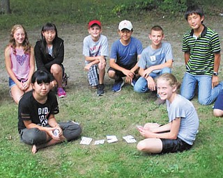 SPECIAL TO THE VINDICATOR | The Labo International Exchange Foundation, a Japanese youth organization, has been exchanging students with 4-H families for more than 50 years. Japanese children change places with local students, ages 10-15, for a one-month stay. They worked with animals, traveled to sporting events, visited Lake Erie and the ocean, worked in gardens, experienced farm life and tried many new foods. The youth also expanded their language skills. The 4-H Labo group gathered Aug. 10 for a farewell picnic at Austintown Township Park. The guests arrived in Ohio on July 23 and return to Japan on Friday. Sitting, from left, are Anri Nakatani with Kaylee Burcaw, her host from North Benton; and kneeling are Mai Miura with Kiah Nelson of Copley, Ohio; Analyse Sutton of Farmdale with Arisu Takubo; Garret Roach of Bristolville with Yuto Ishii; Seth Zorica of Atwater, Ohio, with Hayato Takahashi; and Maggie Graber of Louisville, Ohio, with Erika Takata. Soko Kitai was their chaperone. The exchange is open to families who qualify and the program is explained at www.ohio4h.org/youth/international.