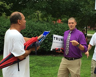 Robert McFerren | The Vindicator..Robert Jiles, left, 62 treads old from Youngstown, debates with Trump supporter Zach Van Brocklin, 32, from Canfield..