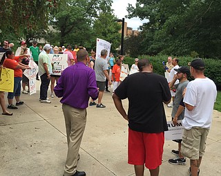 Robert McFerren | The Vindicator..Five Trump supporters(right foreground) engage with anti-Trump protestors in the background.