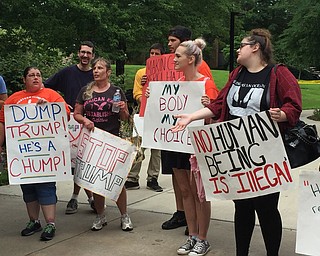 Robert McFerren | The Vindicator..Protestors gather outside the Kilcawley center at Youngstown State University ahead of Donald J. Trump's arrival.