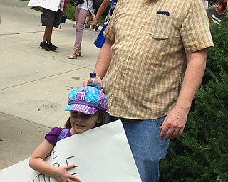 Robert McFerren | The Vindicator..lana Kieran, 5, and her father, TJ, right, attended the Trump protest rally on Monday. Kieran wanted his daughter to see democracy in action.