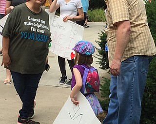 Robert McFerren | The Vindicator..lana Kieran, 5, and her father, TJ, right, attended the Trump protest rally on Monday. Kieran wanted his daughter to see democracy in action.