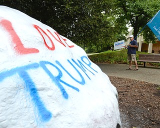 Jeff Lange | The Vindicator  MON, AUG 15, 2016 - Werner Lange of Newton Falls marches around YSU's rock painted "Love Trump" prior to Donald Trump's speech at the Kilcawley Center, Monday, Aug. 15, 2016.