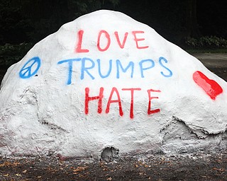 Nikos Frazier | The Vindicator.."Love Trumps Hate" is written on the Youngstown State University rock.