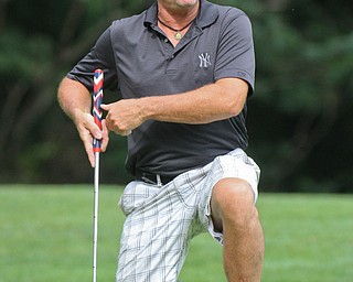 William D. Lewis The Vindicator Pete Bernat of the Donnell ford Scramble team reacts to a putt during GGOV Scramble Aug. 15, 2016 t the Lake Club.