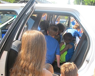 Neighbors | Alexis Bartolomucci.The students at Hitchcock Woods Daycare had the opportunity on July 19 to explore the inside and outside of a police car at their school.