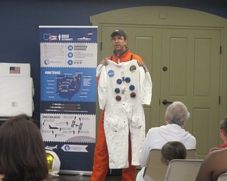 Neighbors | Alexis Bartolomucci.A representative from the Armstrong Air and Space Museum came to the Boardman library on July 22 and held up a replica of a spacesuit for the children to look at.