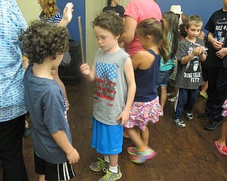 Neighbors | Alexis Bartolomucci.Two of the children who attended the Air and Space program at the Boardman library on July 22 practiced catching a falling ruler before it hit the ground.