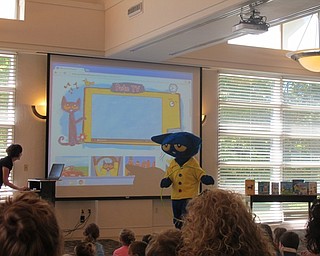 Neighbors | Alexis Bartolomucci.Pete the Cat visited the Austintown library on July 27 to sing and interact with the children.