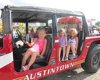 Neighbors | Alexis Bartolomucci.Gianna, Olivia and Quinn sat inside an Austintown Fire Department vehicle at the Austintown Night Out event on Aug. 2 at Austintown Township Park.