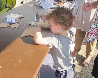 Neighbors | Alexis Bartolomucci.Anthony worked on making his wood working craft that was provided by the Austintown Home Depot for children who attended the Austintown Night Out event on Aug. 2 at the Austintown Township Park.