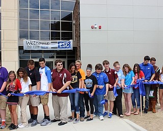 Neighbors | Abby Slanker.Nearly two dozen students representing Mahoning County Educational Service Center member districts celebrated the opening of the new Mahoning County Educational Service Center by cutting a second ribbon for the facility on Aug. 4.