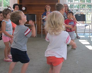 Neighbors | Alexis Bartolomucci.Children who attended the Baby Brilliant program at the library on Aug. 4 chased bubbles while listening to a song.