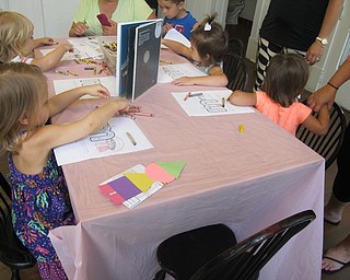 Neighbors | Alexis Bartolomucci.The children who attended the Baby Brilliant story time colored in their mazes after the program was over on Aug. 4 at the Poland library.