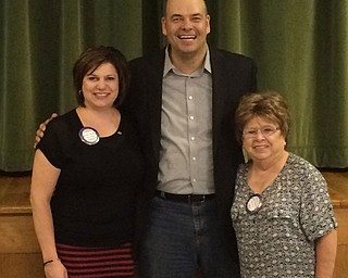 SPECIAL TO THE VINDICATOR
Dr. Adam Earnheardt, chairman and associate professor of communication at Youngstown State University, presented a discussion of social media to Struthers Rotary on July 19. He suggested not to get Pokemon Go unless you want to be addicted. Earnheardt is the father of four children and is author of a weekly social media column in The Vindicator. He said that on a positive note, Pokemon Go does promote physical activity and personal human interaction. For more of his views, contact him at acearnheardt@ysu.edu. On either side of Earnheardt, center, are Jennifer Johnson, left, host rotarian; and JoAnn Cabuno Sweeney, Struthers Rotary president.