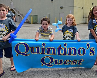 BOARDMAN, OHIO - AUGUST 13, 2016: (LtoR) Walker Hurdley 6, Quintino Desantis 7, Carmella Hurdley 3, and Giada Desantis 7, all from Poland walk while carrying the banner for their group Quintino's Quest during the Buddy Walk, Saturday morning at the Shops at Boardman Park. DAVID DERMER | THE VINDICATOR
