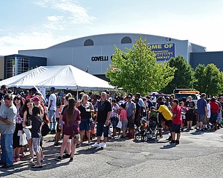 YOUNGSTOWN, OHIO - AUGUST 13, 2016: People line up outside of the Covelli Center waiting to pick out a new book bag during the NOW Youngstown book bag giveaway. DAVID DERMER | THE VINDICATOR