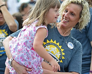 BOARDMAN, OHIO - AUGUST 13, 2016: Cheri Pascarella of Boardman holds her granddaughter Addison Griggy 4, as the two dance to the music before the start of the Buddy Walk, Saturday morning at the Shops at Boardman Park. DAVID DERMER | THE VINDICATOR