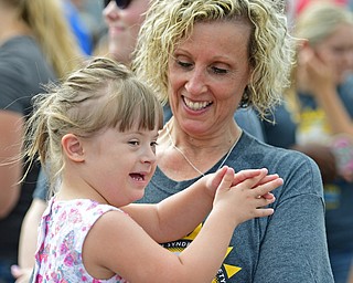 BOARDMAN, OHIO - AUGUST 13, 2016: Cheri Pascarella of Boardman holds her granddaughter Addison Griggy 4, of Poland as the two dance to the music before the start of the Buddy Walk, Saturday morning at the Shops at Boardman Park. DAVID DERMER | THE VINDICATOR