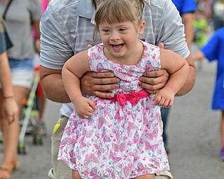 BOARDMAN, OHIO - AUGUST 13, 2016: Ray Griggy of Boardman smiles while playing a game with his daughter as the two participate in the Buddy Walk,  Saturday morning at the Shops at Boardman Park. DAVID DERMER | THE VINDICATOR