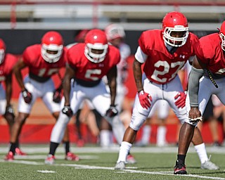 YOUNGSTOWN, OHIO - AUGUST 20, 2016: Jamar Pinnock #6, Kieran Winn and Lee Wright #5 wait to run downfield to cover a kickoff during a scrimmage Saturday morning at Stambaugh Stadium. DAVID DERMER | THE VINDICATOR