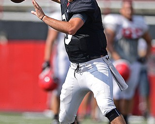 YOUNGSTOWN, OHIO - AUGUST 20, 2016: Hunter Wells #6 (black) throws a pass during a scrimmage Saturday morning at Stambaugh Stadium. DAVID DERMER | THE VINDICATOR