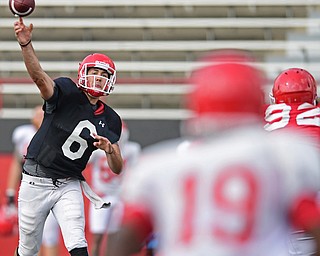 YOUNGSTOWN, OHIO - AUGUST 20, 2016: Hunter Wells #6 (black) throws a pass to Damoun Patterson #19 (white) during a scrimmage Saturday morning at Stambaugh Stadium. DAVID DERMER | THE VINDICATOR