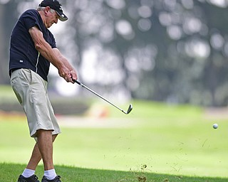 LIBERTY, OHIO - AUGUST 20, 2016: Frank Davidson of Canfield chips from the short rough back onto the fairway on the third hole Saturday afternoon at Youngstown Country Club. DAVID DERMER | THE VINDICATOR